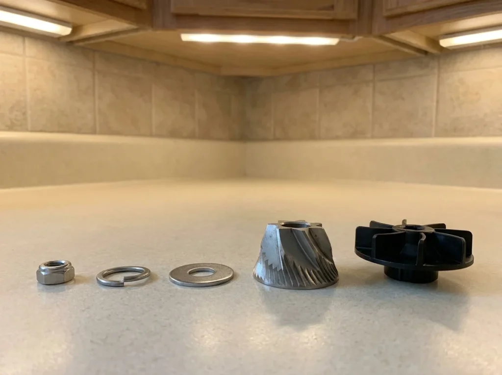 Barista Express Impress grinder parts laid out for reassembly